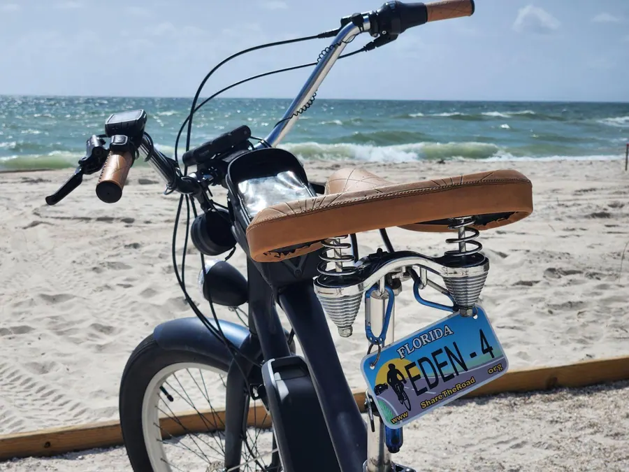 Premium Eden e-bike on a scenic beach path